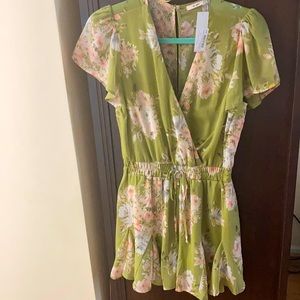 Green floral romper with flutter sleeves from Francesca’s.